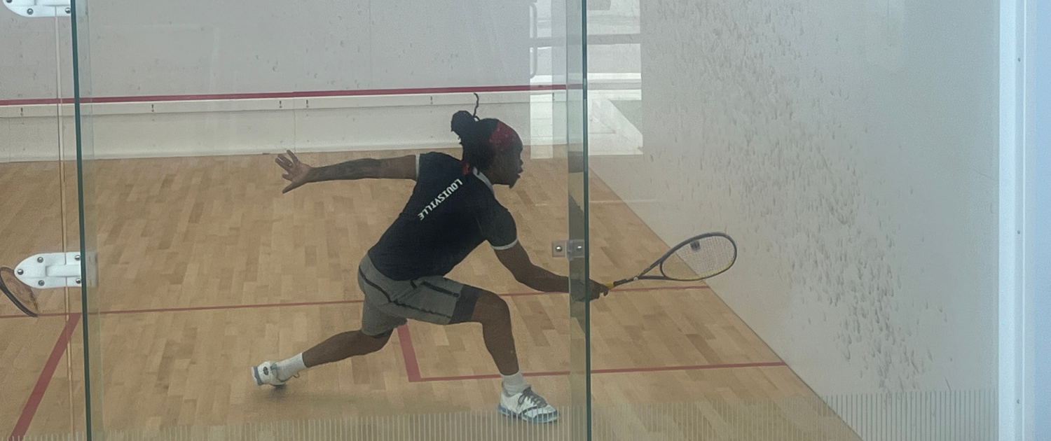 Action shot of Coach Kay Zee Sitshebo playing Squash on the Louisville Squash Plus courts